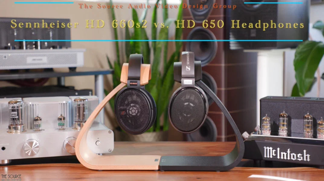 Sennheiser HD 660S2 and HD 650 headphones on stands between McIntosh audio equipment at The Source AV.
