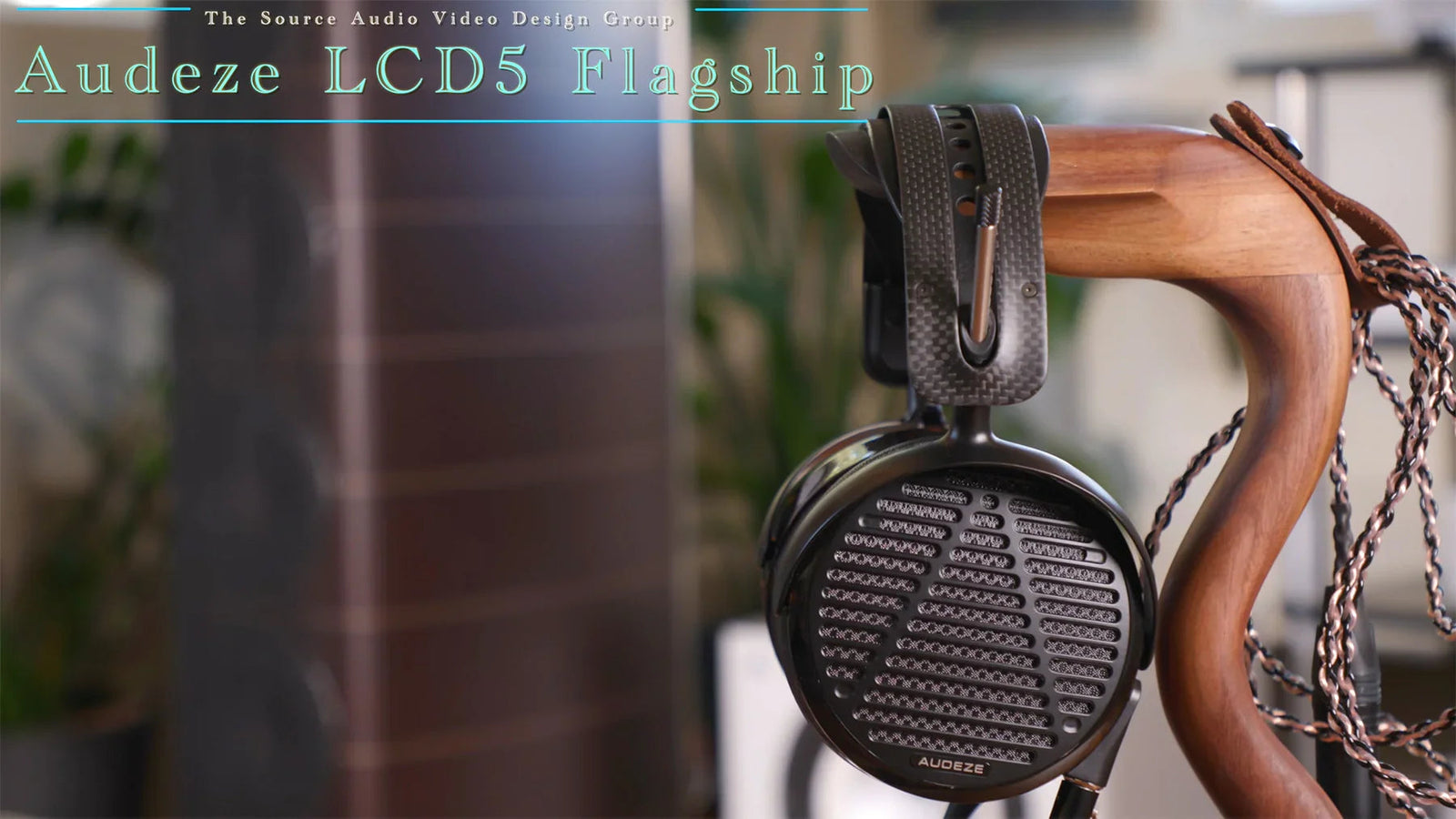 Audeze LCD5 flagship headphones on wooden stand at The Source AV audio video store