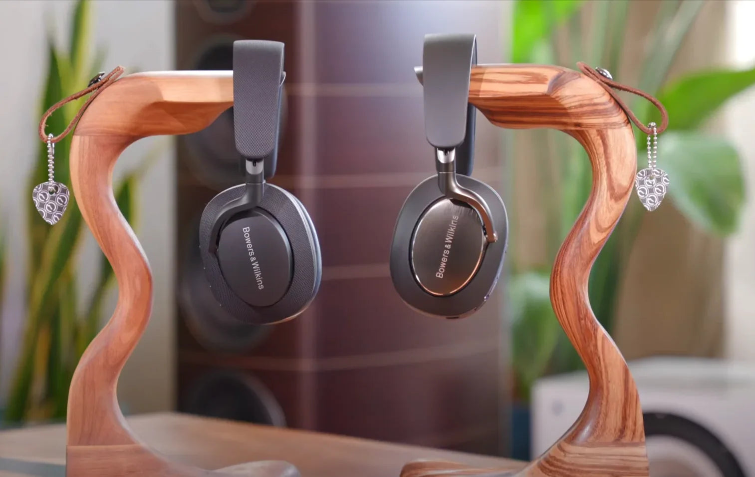 Bowers & Wilkins Px7 S2 and Px8 wireless headphones on wooden stand at The Source AV.