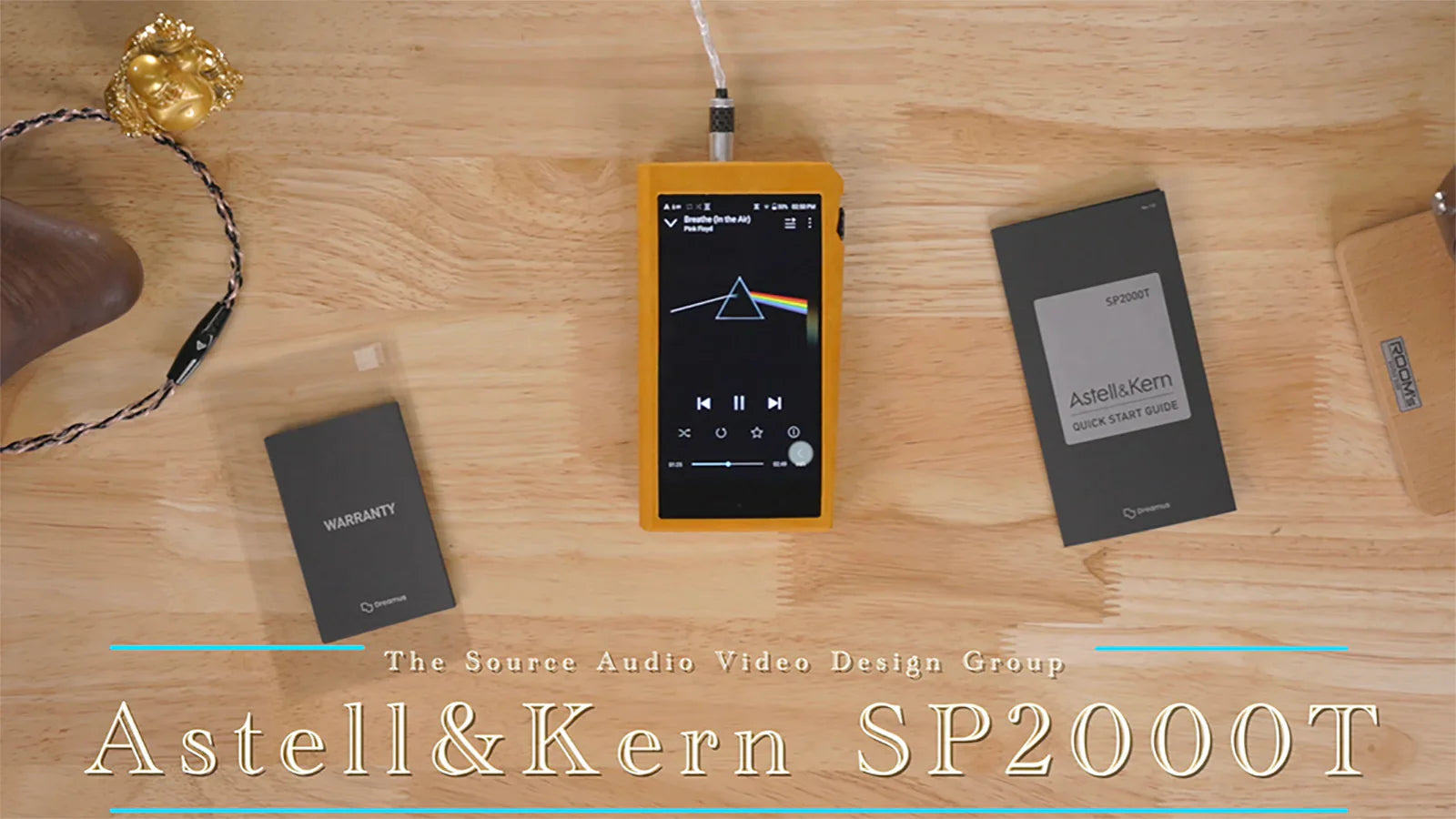 Astell&Kern SP2000T portable music player with display and accessories on wooden table at The Source AV