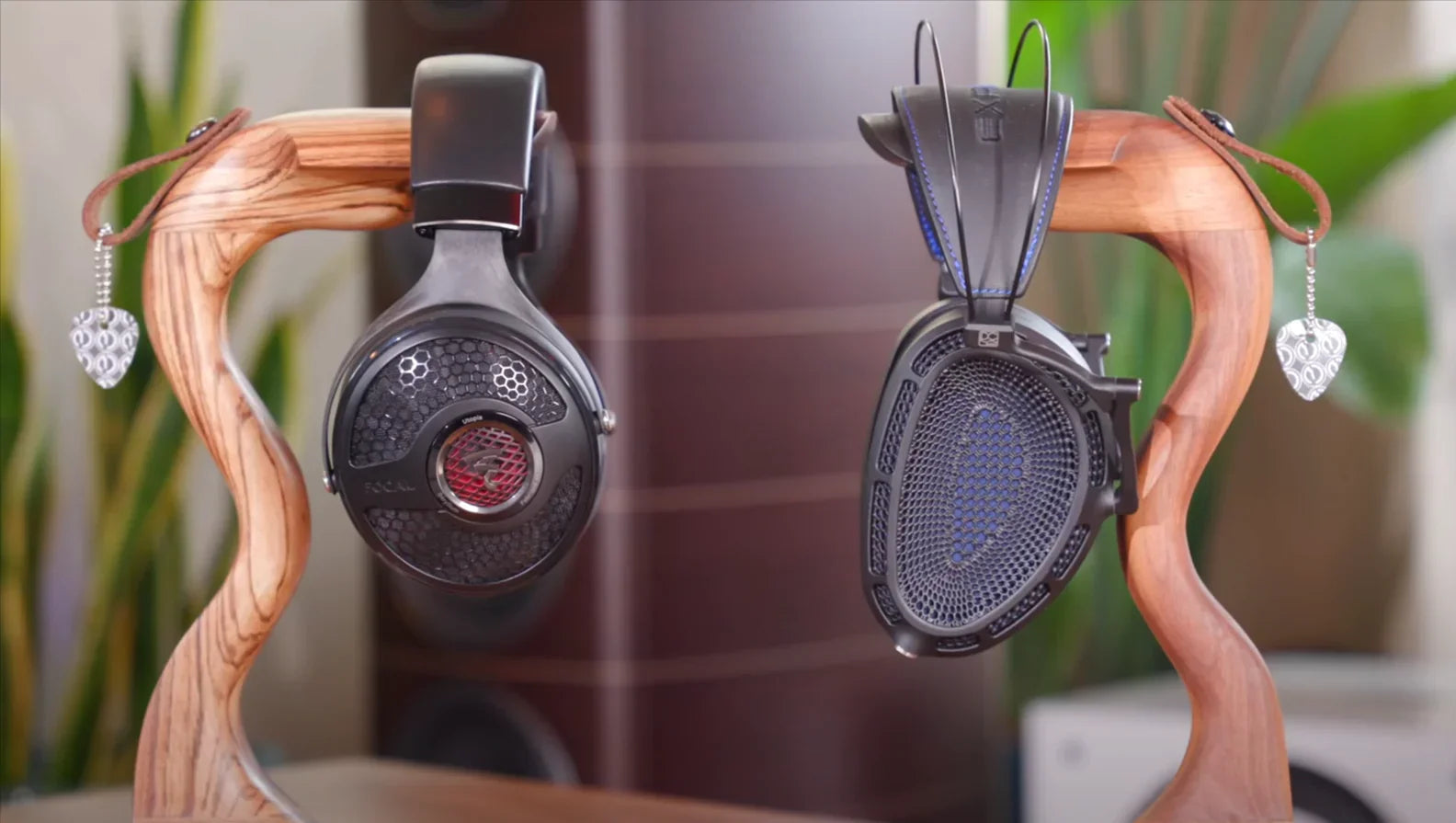High-end headphones on wooden stand at The Source AV, audio equipment display